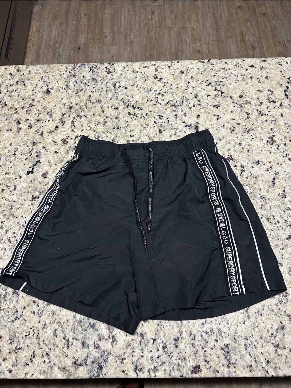 Superdrysport women’s Black Athletic Shorts with Side Stripe Detailing